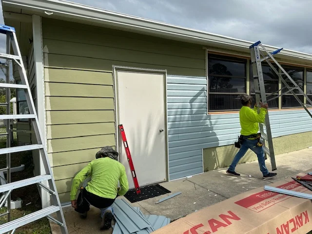 RFH siding installation crew at a Clearwater mobile home