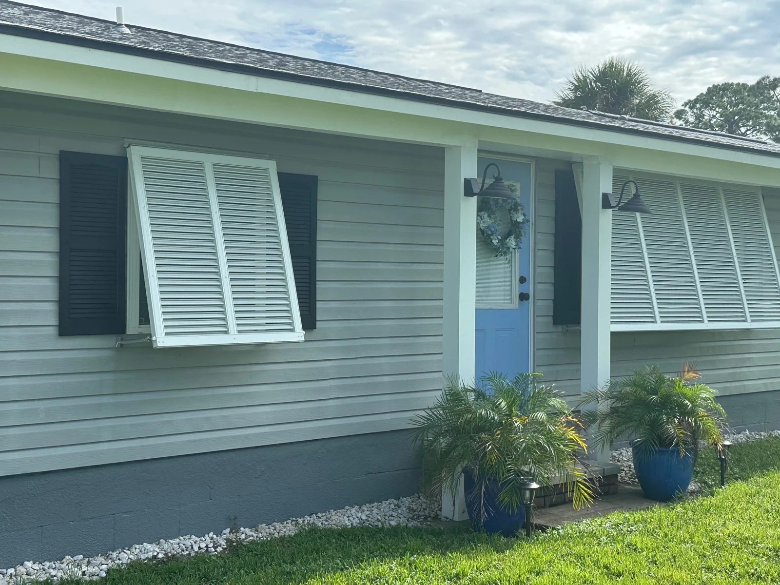 Completed gray vinyl siding and white trim from RFH project gallery